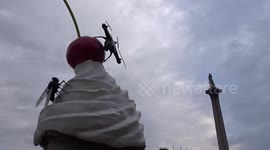 The End by Heather Phillipson reflects on mass surveillance as it tops the fourth plinth in Trafalgar Square with a giant swirl of whipped cream and a drone