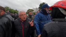 Man pulls out weapon during protest outside school accused of racism