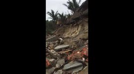 Scene of the sea shoreline dissolves and severe landslides after the Vamco storms landed in Central Vietnam