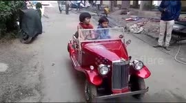 Father in India builds miniature vintage car for daughter
