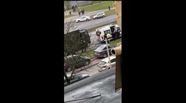 Riot police carry allegedly unconscious woman to ambulance during protest in Belarus