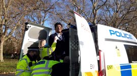 Police struggle to put man into police van at Speakers' Corner in London
