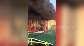 Dramatic moment family are rescued from burning house in the Philippines