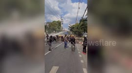 Riot police fire water cannon to disperse demonstrators in Thailand