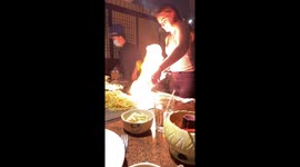 US girl almost burns her face when using hibachi grill at restaurant