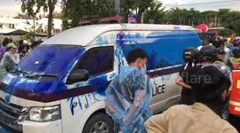 Protesters smear police van with blue paint during clashes in Thailand
