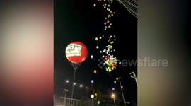 Protesters release balloons after day of violence in Thailand