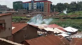 Clouds of teargas hit homes during police operation dispersing the angry crowd in Kampala, Uganda