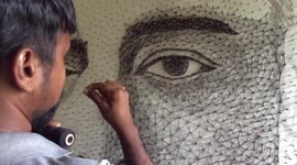 Artist ties string around thousands of nails to create impressive portrait of Indian actor