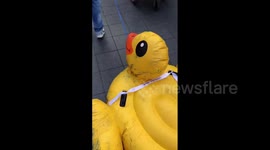 Thailand: ‘War-Torn’ Inflatable Duck Makes An Appearance Ahead Of Protest At Ratchaprasong Intersection In Bangkok