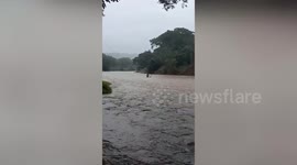 Residents wade through El Salvador river amid Hurricane Iota floods
