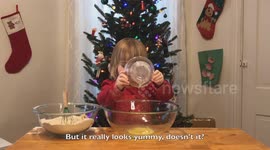 Cute three-year-old chef Susie gets ready for Christmas with gingerbread