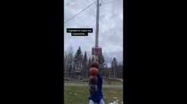 Canadian circus artist makes impossible trick shot with four basket balls