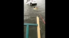 Elderly man in India heroically rescues young man drowning in his car