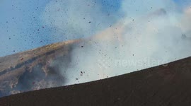 Mount Etna spews steam and volcanic material from southeast crater