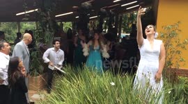 Man destroys bridal bouquet during flower toss