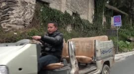 Man drives 'convertible minibus in China