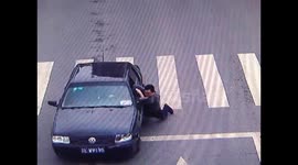 Driver drags creditor from side of car in China