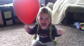 Baby Plays with a Balloon for the First Time -- HILARIOUS