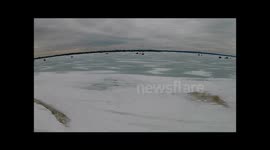 Amazing aerial footage of ice fishing village in Canada