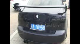 Driver customizes Mazda car with Apple logo