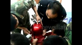 Firemen rescue toddler's head from spittoon
