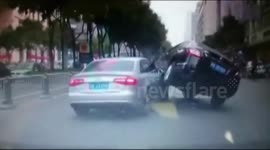 Car drives on top of other car in China road rage