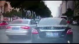 Car drives on top of other car in China road rage incident