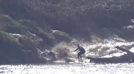 Solo surfer tackles huge Severn Bore wave