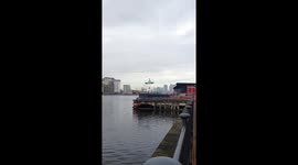 Luxury Jag driven over River Thames