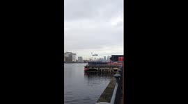 Luxury Jag driven over River Thames