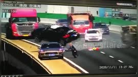 Car flips over and flies off bridge after dramatic collision with truck on Chinese highway