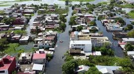 A car in the middle of a flooded road in Mexico