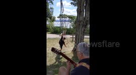 Heartwarming footage features father, son duet via circus act and guitar