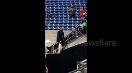 NFL star J.J. Watt climbs barrier, walks up stands to personally gift football to young Texans fan