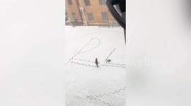 School teacher in China writes physics formula in snow so students don't forget
