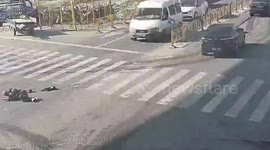 Elderly Chinese man escapes without serious injuries after being run over by truck