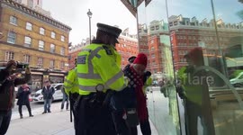 Elderly anti-vaccine protester arrested outside Bill and Melinda Gates Foundation office in London