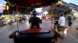 Tuk Tuk Drives Through the Cambodia Street at Night