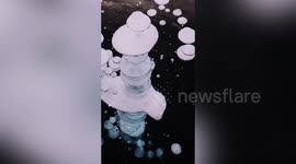 Winter weather in China produces natural phenomenon as methane bubbles freeze in lake