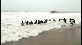 Fisherman staged a bizarre protest in the rough sea as they don’t know ways to safeguard their boats in Pudhucherry South India