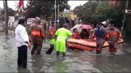 People in India evacuated in inflatable boats as rain continues to lash the city of Chennai