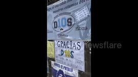 Argentinian fans leave support messages outside hospital where Diego Maradona had brain surgery