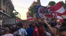 Fans of Diego Maradona sing and wave flags outside his first club Argentinos Juniors in Buenos Aires