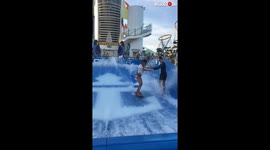 Woman surfs on cruise ship in the Bahamas