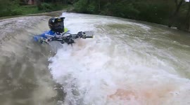 Waters nearly swallow dirt bike and rider after river crossing in Spain