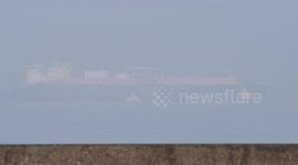 Two ships pass in heavy fog in Sheerness, Kent, UK