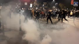 French police fire tear gas at protest against draft law that could ban filming police