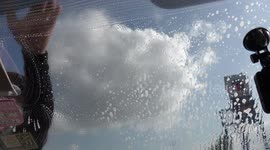 Super fast windscreen wash at a petrol filling station in Thailand.