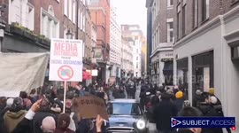 London anti-lockdown protesters march through narrow Soho streets